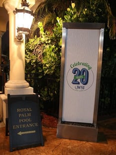 Photo of WSI Convention with Celebrating 20th Anniversary banner.