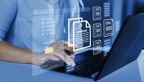 Person working on a laptop with digital invoice icons, illustrating the role of a data processor or controller in action.