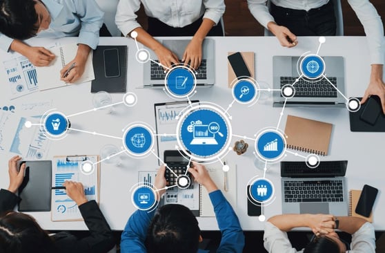 A dynamic business team collaborates in a modern office setting.