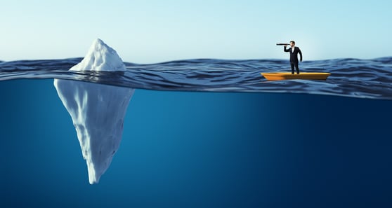 Businessman on small boat looking through telescope at iceberg, symbolizing hidden risks and challenges beneath the surface.