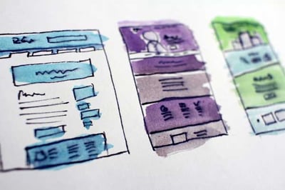 Hand-drawn website wireframes illustrating design ideas for A/B testing for landing pages.