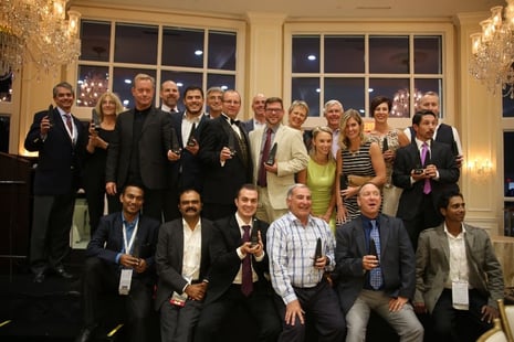 Photograph of WSI Consultants with awards in their hands.