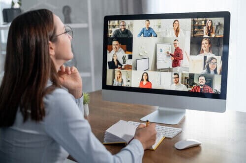 Professional woman on a video conference showing how to manage a remote sales team effectively.