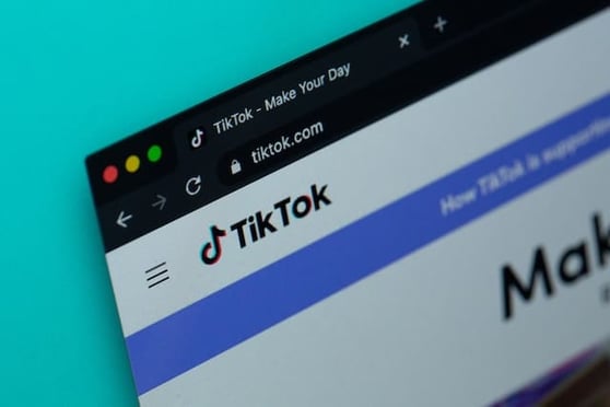 Browser showing TikTok homepage, part of a visual guide to TikTok ads for new advertisers.