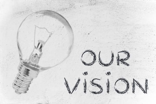 Lightbulb with “Our Vision” text, symbolizing strategic thinking and long-term planning where competition is good.